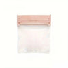A clear plastic jewelry storage bag with a pink sealing flap, designed for rings, necklaces, and bracelets.