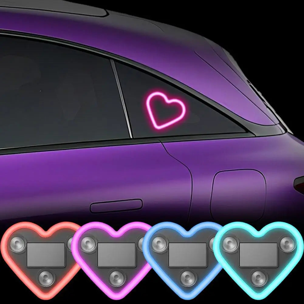 A purple car window features a glowing pink heart neon light design.