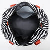Black and white zebra print duffle bag with wet/dry compartments