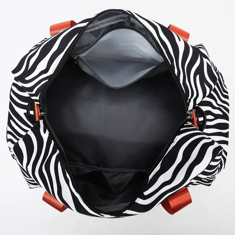 Black and white zebra print duffle bag with wet/dry compartments