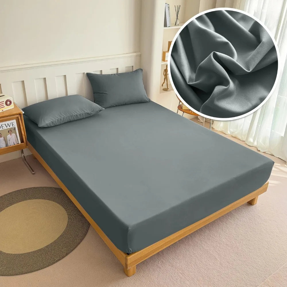 A fitted bed sheet in solid gray is displayed on a bed, with a close-up showing the fabric texture.