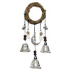 A rustic witch bells door hanger wind chime made of woven branches and silver bells.