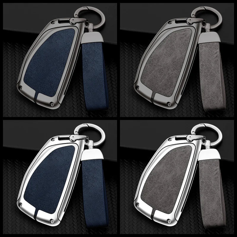 A set of durable zinc alloy and leather car key cases in dark blue and black.