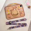 A tan silicone case for an iPad featuring cute cartoon capybara designs and a protective grip.