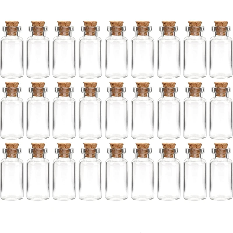 A row of small, clear glass bottles with cork stoppers arranged in a grid.