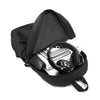 A black minimalist canvas backpack shown in various views, including on a person and isolated shots of the bag and straps.