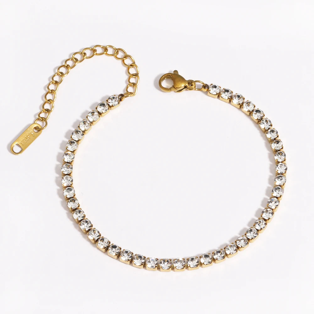 A gold-plated stainless steel link bracelet with small clear stones.