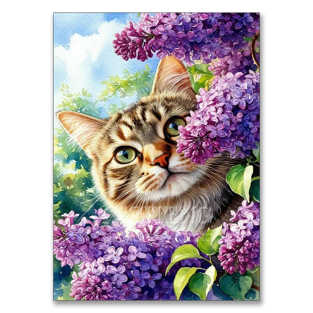 A tabby kitten looks up through a vibrant purple hydrangea flower display.