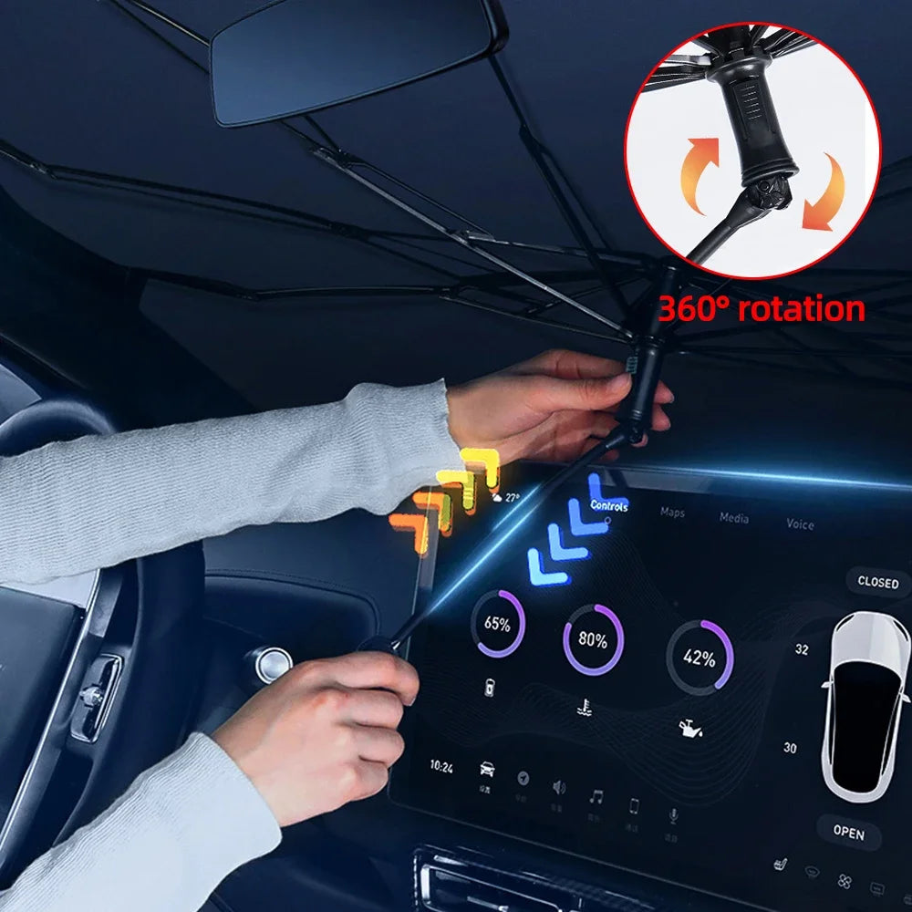 A hand is demonstrating the 360 degree rotation feature of a foldable car sun shade umbrella on a vehicle dashboard.