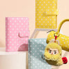A set of three colorful PU leather binder wallets featuring polka dots and a yellow fluffy keychain.