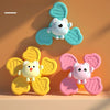 A set of three silicone spinning bath toys featuring cute animal figures in light blue, yellow, and pink.