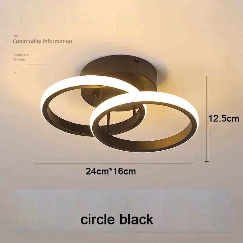 A black ring LED ceiling light fixture with a circular design and a white glow.