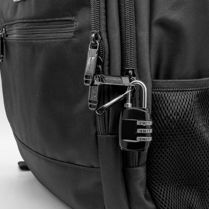 Close-up of a black backpack featuring a zippered pocket with a security lock.