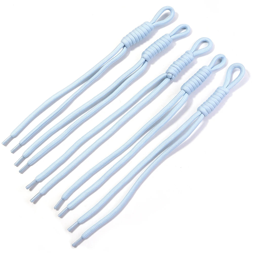 A set of light blue braided nylon lanyards with woven loops for keychains and DIY crafts