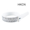 A white adjustable ring and bracelet sizer measuring tool with numbered markings.