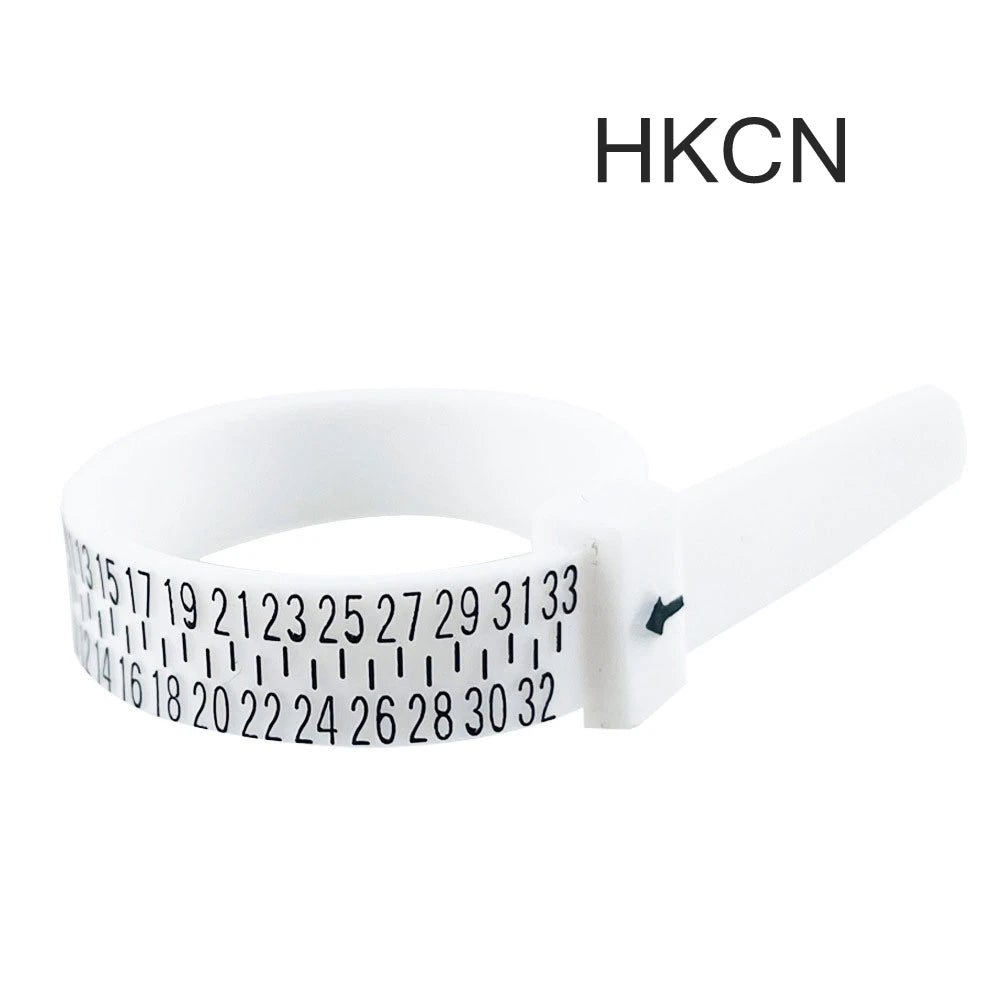 A white adjustable ring and bracelet sizer measuring tool with numbered markings.