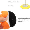 A hand holds an orange sponge and a black pad component of a headlight restoration kit.