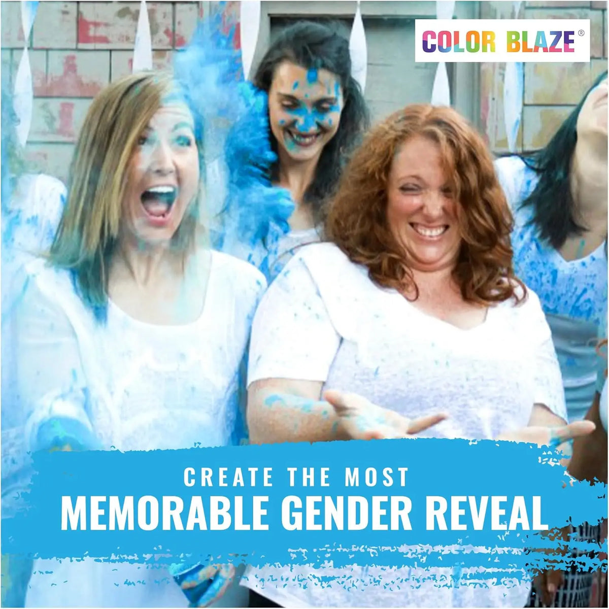 Three women laughing and covered in blue powder celebrating a gender reveal event.