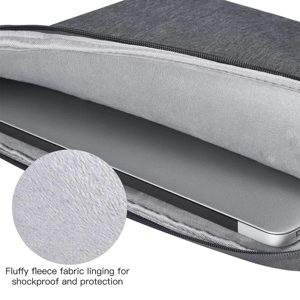 A gray fluffy fleece lining inside a laptop sleeve for shockproof and protection.