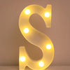 A glowing white LED letter night light shaped like the letter S, featuring multiple illuminated dots.