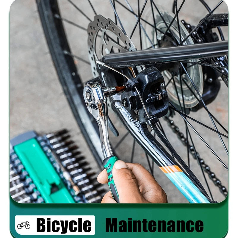 A hand is holding a chrome vanadium socket set with a quick-release ratchet and extension on a bicycle component.