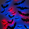 Black bat silhouettes with red and blue LED glow against a dark background for Halloween decor