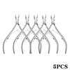 Five pairs of professional stainless steel manicure tools including cuticle trimmers and pushers