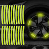 A set of bright yellow reflective vertical strips and a glowing wheel hub sticker on a car tire.