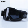 Black retro motorcycle sunglasses with night vision lenses displayed on a white surface.