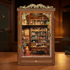 A wooden cabinet with glass doors displaying an illuminated miniature book house shelf insert.