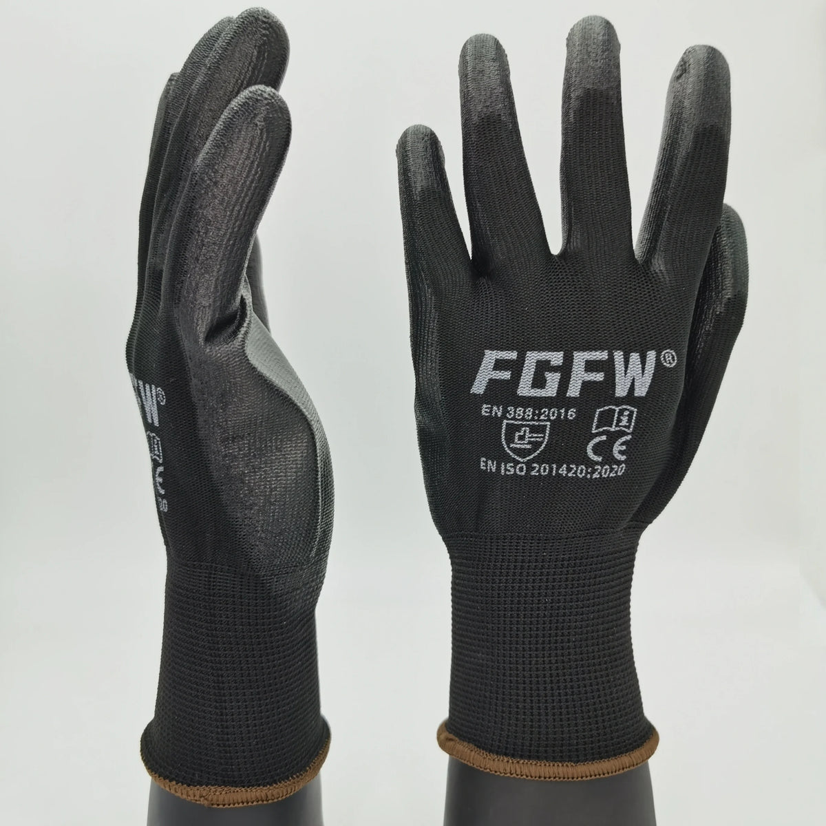 A pair of black breathable PU-coated work gloves with reinforced grip and EN 388:2016 certification visible.