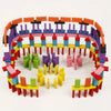 A large set of multicolor wooden domino building blocks arranged in a circular pattern.