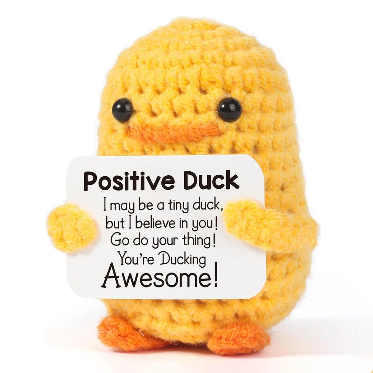A yellow crocheted plush duck with black eyes and orange feet.