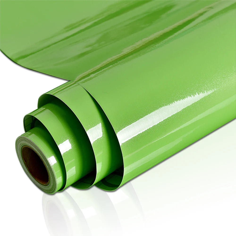 A roll of smooth, glossy lime green waterproof self-adhesive marble wallpaper.