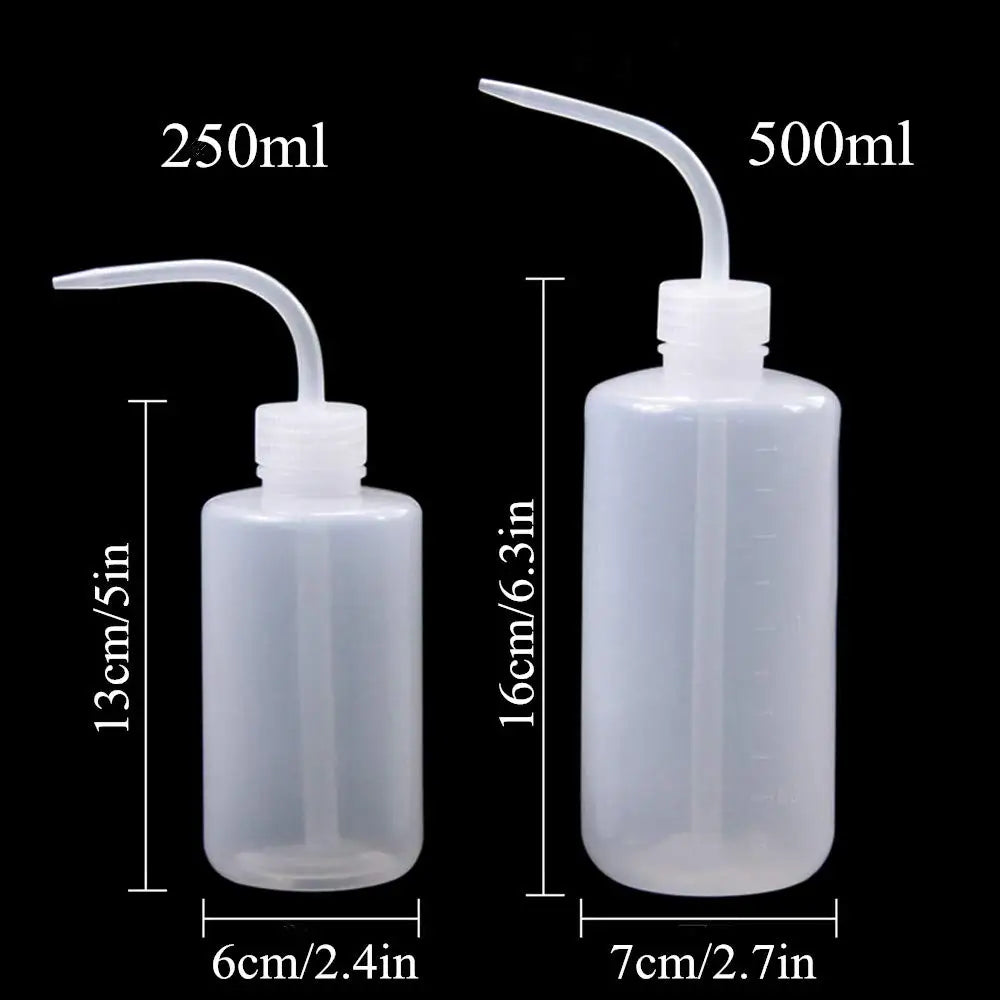 A set of clear plastic tattoo squeeze bottles with precision tips, labeled for 250ml and 500ml sizes.