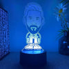 A glowing blue 3D illusion sports night light featuring a male face with a beard and a number 10 on a dark base.