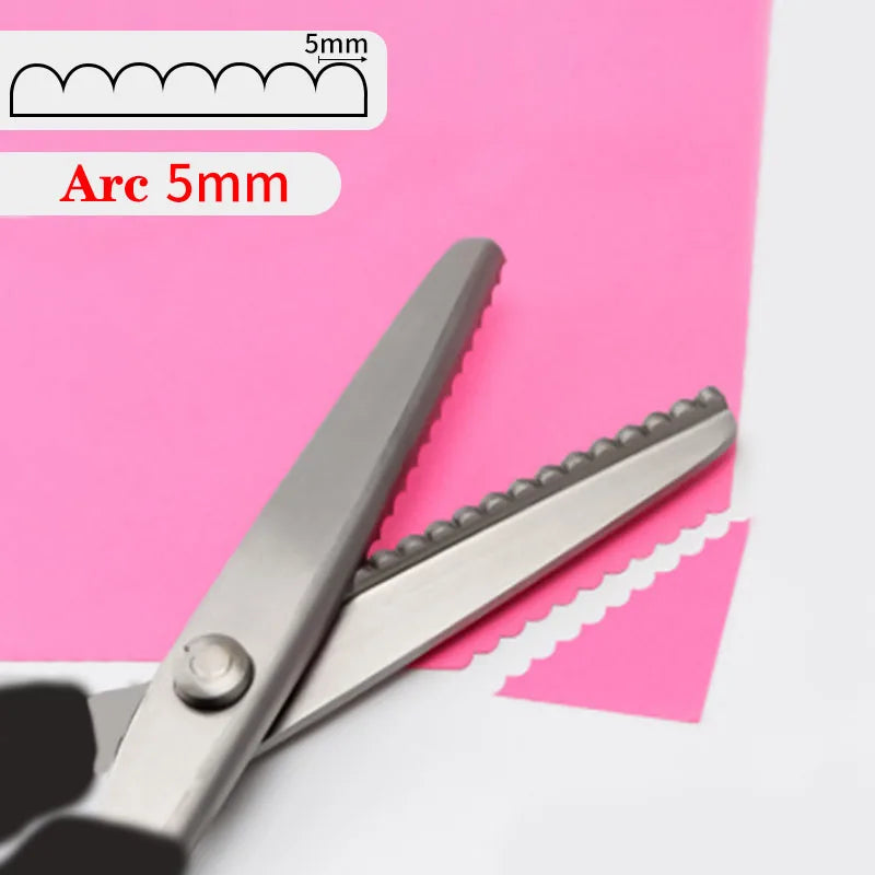 Close-up of stainless steel pinking shears with a 5mm arc marking on pink paper.