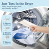 A hand places dryer sheets into a washing machine drum for laundry.