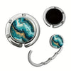 Silver bag hook with a marbled turquoise and gold pattern design