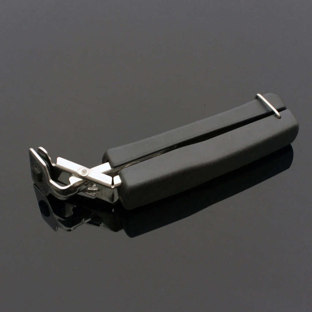 A black stainless steel hot pot and bowl gripper tool shown against a dark gray background.