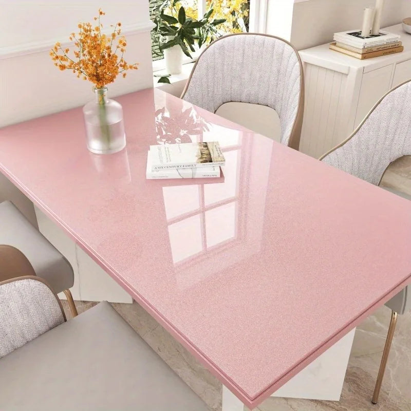 Glossy pink marble contact paper displayed on a rectangular countertop with surrounding dining chairs and decor.