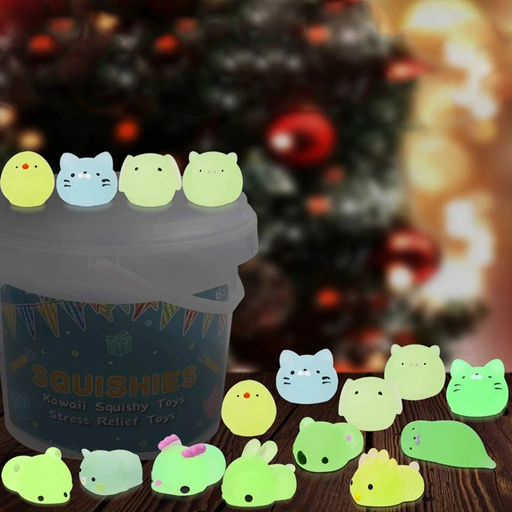 A collection of glow-in-the-dark kawaii animal squishy toys in various colors and shapes displayed in a jar.