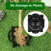 A black reusable plant rooting ball with a hinged lid is shown resting on green artificial turf.