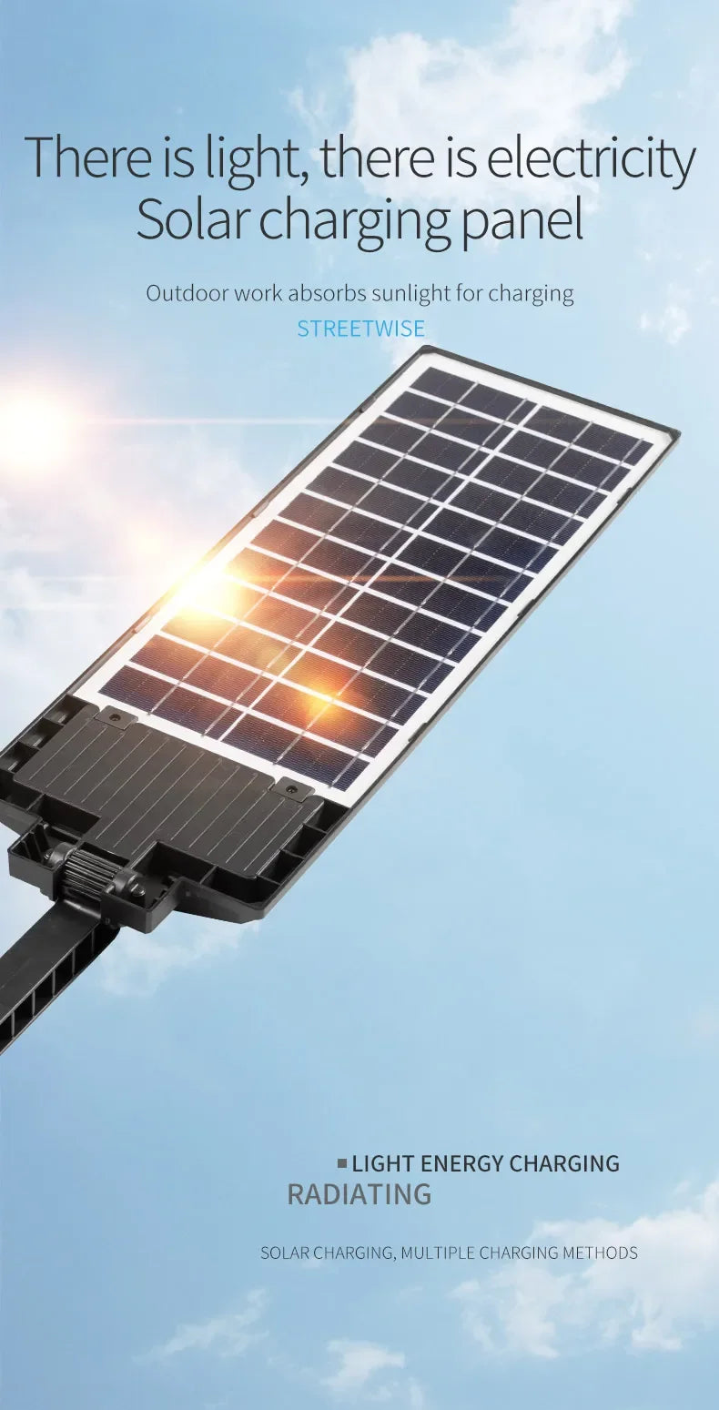 A black solar charging panel is angled towards the sun, demonstrating light energy charging.