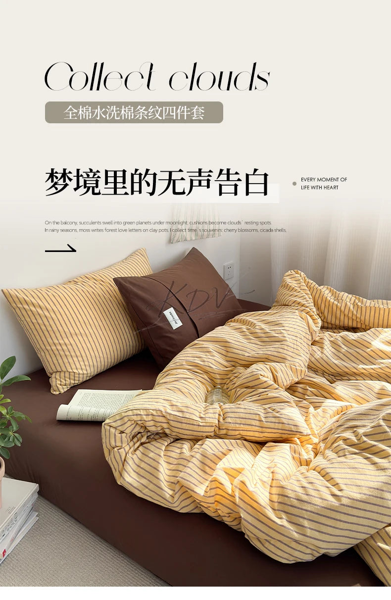 A set of four striped cotton duvet covers displayed on a bed with pillows and bedding.