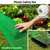 A hand holds a bright green plastic safety net mesh in a garden setting, demonstrating its sturdy and reusable material.