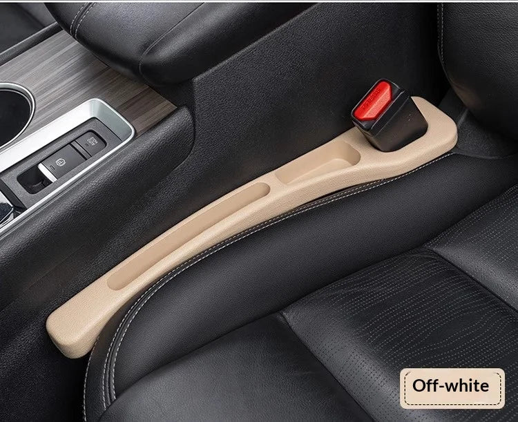 A beige gap plug strip is shown in a black car seat interior, designed to stop items from slipping between seats.