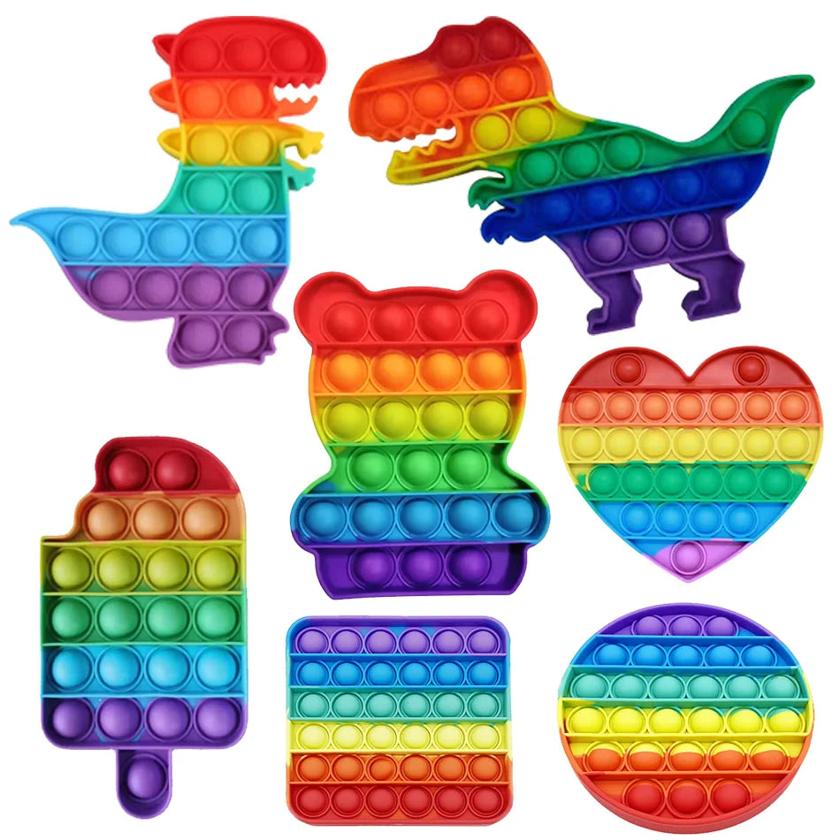 A collection of colorful rainbow pop bubble fidget toys in various shapes and sizes.