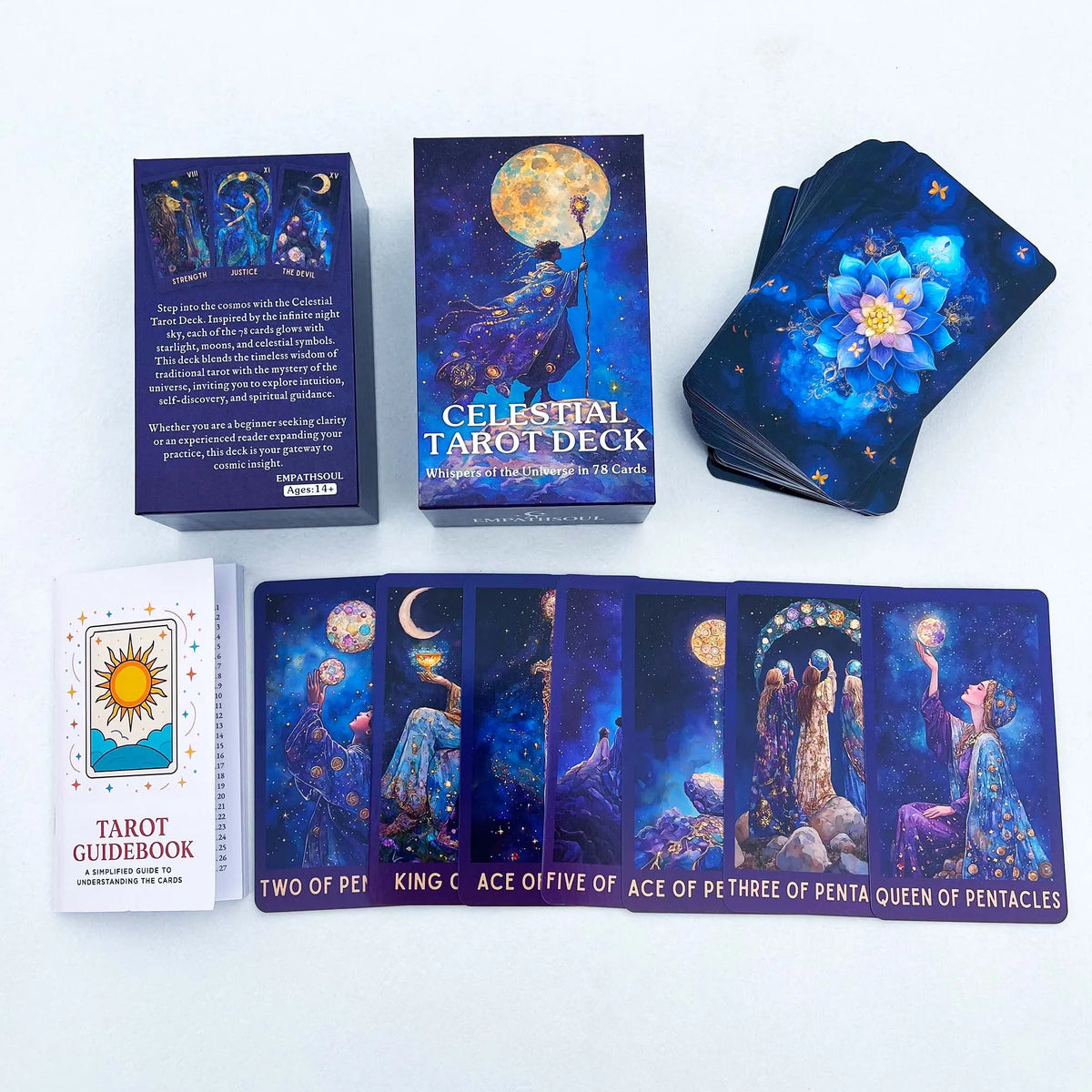 A set of Celestial Tarot decks including a box, a guidebook, and several individual cards showing celestial imagery.