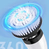 A close-up view of a white electric spin scrubber with a rotating brush head and blue light effect.